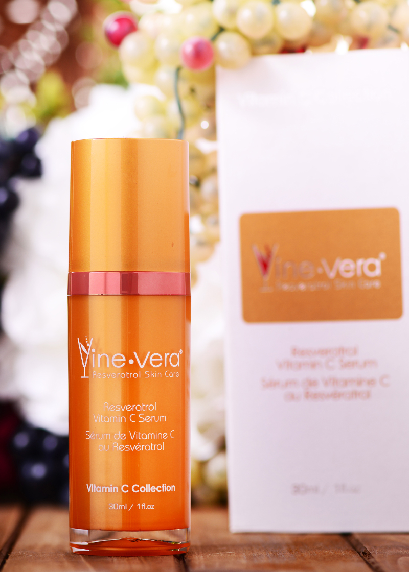 Resveratrol Vitamin C Serum with a background